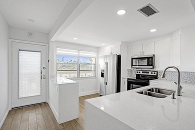 Discover this stunning top-floor 2-bed, 2-bath condo in the on Wynmoor Golf Course in Florida - for sale on GolfHomes.com, golf home, golf lot