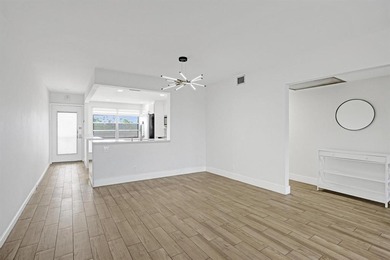 Discover this stunning top-floor 2-bed, 2-bath condo in the on Wynmoor Golf Course in Florida - for sale on GolfHomes.com, golf home, golf lot