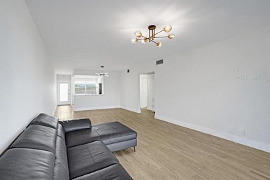 Discover this stunning top-floor 2-bed, 2-bath condo in the on Wynmoor Golf Course in Florida - for sale on GolfHomes.com, golf home, golf lot