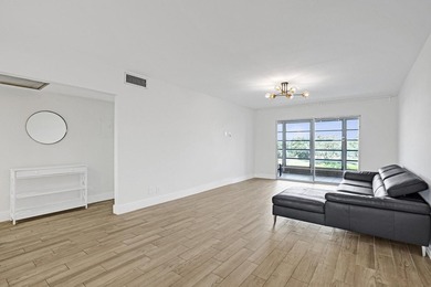 Discover this stunning top-floor 2-bed, 2-bath condo in the on Wynmoor Golf Course in Florida - for sale on GolfHomes.com, golf home, golf lot