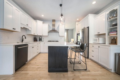 Welcome to this stunning 4-bedroom, 4-bathroom home situated on on Boulder Creek Golf Club in Michigan - for sale on GolfHomes.com, golf home, golf lot