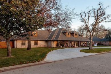 Nestled within the premier enclave of Oak Hollow Road in North on Quail Creek Golf and Country Club in Oklahoma - for sale on GolfHomes.com, golf home, golf lot