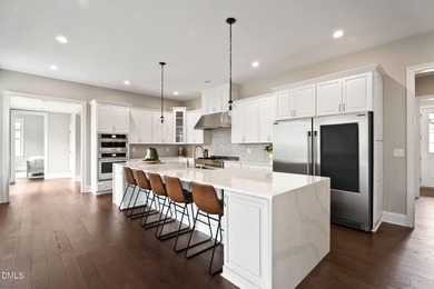 From holiday dinners to movie nights, this home was made for on Hasentree Club in North Carolina - for sale on GolfHomes.com, golf home, golf lot