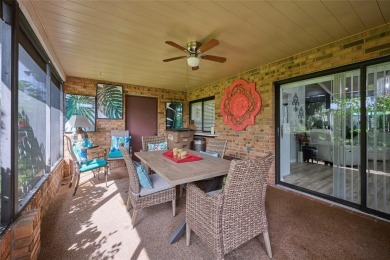 Nestled beneath a stunning magnolia tree in the front  a stately on Sun n Lake Golf and Country Club in Florida - for sale on GolfHomes.com, golf home, golf lot