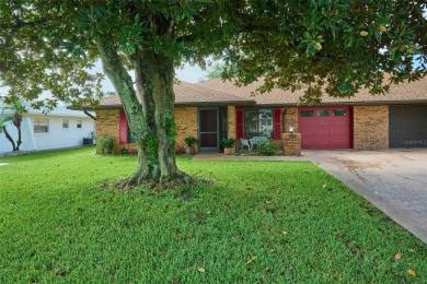 Nestled beneath a stunning magnolia tree in the front  a stately on Sun n Lake Golf and Country Club in Florida - for sale on GolfHomes.com, golf home, golf lot