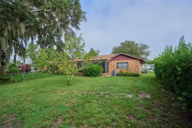Nestled beneath a stunning magnolia tree in the front  a stately on Sun n Lake Golf and Country Club in Florida - for sale on GolfHomes.com, golf home, golf lot
