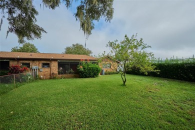 Nestled beneath a stunning magnolia tree in the front  a stately on Sun n Lake Golf and Country Club in Florida - for sale on GolfHomes.com, golf home, golf lot