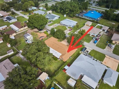 Nestled beneath a stunning magnolia tree in the front  a stately on Sun n Lake Golf and Country Club in Florida - for sale on GolfHomes.com, golf home, golf lot