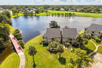 Beautiful corner condominium with serene pond views located in on Plantation Bay Golf and Country Club in Florida - for sale on GolfHomes.com, golf home, golf lot
