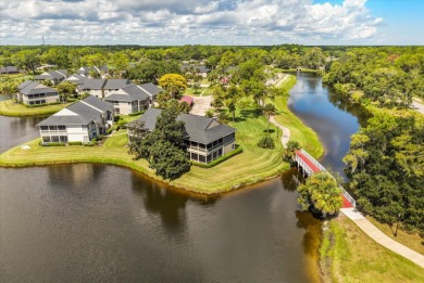 Beautiful corner condominium with serene pond views located in on Plantation Bay Golf and Country Club in Florida - for sale on GolfHomes.com, golf home, golf lot