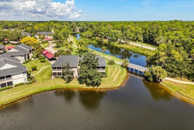 Beautiful corner condominium with serene pond views located in on Plantation Bay Golf and Country Club in Florida - for sale on GolfHomes.com, golf home, golf lot