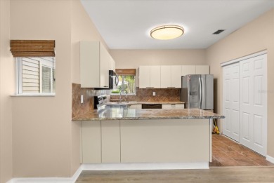 Beautiful corner condominium with serene pond views located in on Plantation Bay Golf and Country Club in Florida - for sale on GolfHomes.com, golf home, golf lot