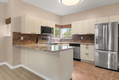 Beautiful corner condominium with serene pond views located in on Plantation Bay Golf and Country Club in Florida - for sale on GolfHomes.com, golf home, golf lot