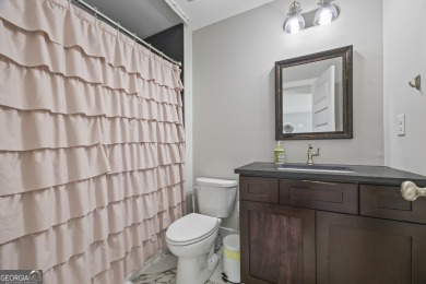 This exceptional six-bedroom, six-and-a-half-bathroom home sits on Lane Creek Golf Club in Georgia - for sale on GolfHomes.com, golf home, golf lot