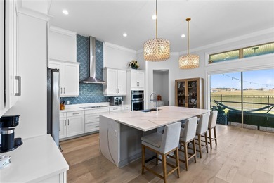 Gated golf course living with panoramic water views in Eagle on Eagle Creek Golf Club in Florida - for sale on GolfHomes.com, golf home, golf lot