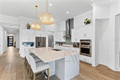 Gated golf course living with panoramic water views in Eagle on Eagle Creek Golf Club in Florida - for sale on GolfHomes.com, golf home, golf lot