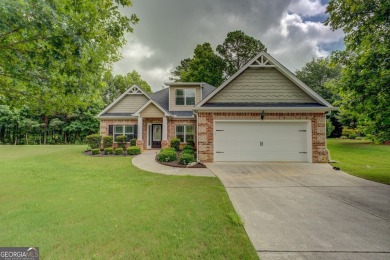 Perfect ranch home in popular Covington Place overlooking the on Indian Creek Golf Club in Georgia - for sale on GolfHomes.com, golf home, golf lot