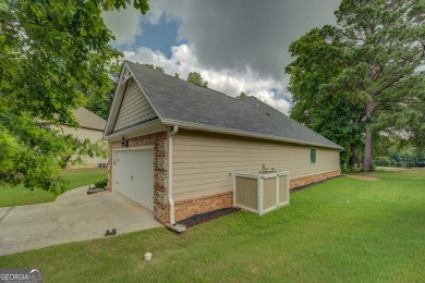 Perfect ranch home in popular Covington Place overlooking the on Indian Creek Golf Club in Georgia - for sale on GolfHomes.com, golf home, golf lot