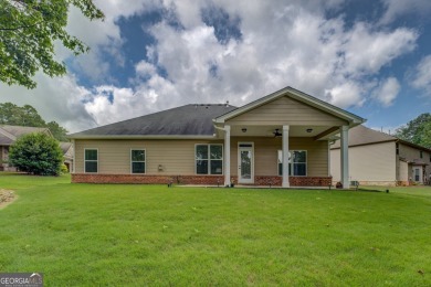 Perfect ranch home in popular Covington Place overlooking the on Indian Creek Golf Club in Georgia - for sale on GolfHomes.com, golf home, golf lot