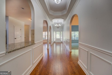 Perfect ranch home in popular Covington Place overlooking the on Indian Creek Golf Club in Georgia - for sale on GolfHomes.com, golf home, golf lot