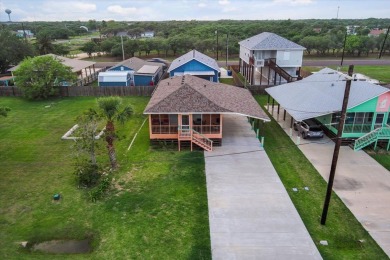 Welcome to this furnished 2-bedroom / 2-bathroom coastal bay on Rockport Country Club in Texas - for sale on GolfHomes.com, golf home, golf lot