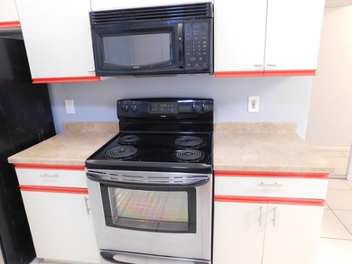 Welcome to this spacious first-floor condo, perfectly situated on Poinciana Golf Club in Florida - for sale on GolfHomes.com, golf home, golf lot