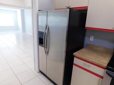 Welcome to this spacious first-floor condo, perfectly situated on Poinciana Golf Club in Florida - for sale on GolfHomes.com, golf home, golf lot