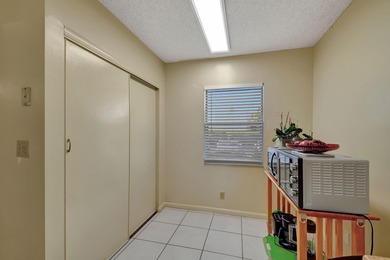 Welcome to this spacious first-floor condo, perfectly situated on Poinciana Golf Club in Florida - for sale on GolfHomes.com, golf home, golf lot