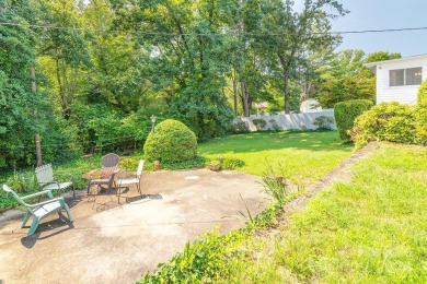 This stylish ranch home with mid century modern touches is a on Asheville Municipal Golf Course in North Carolina - for sale on GolfHomes.com, golf home, golf lot