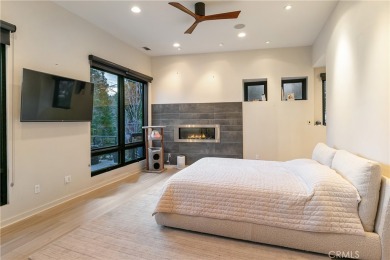 This magnificent listing features a modern home with a guest on Lake Arrowhead Country Club in California - for sale on GolfHomes.com, golf home, golf lot