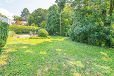 This stylish ranch home with mid century modern touches is a on Asheville Municipal Golf Course in North Carolina - for sale on GolfHomes.com, golf home, golf lot