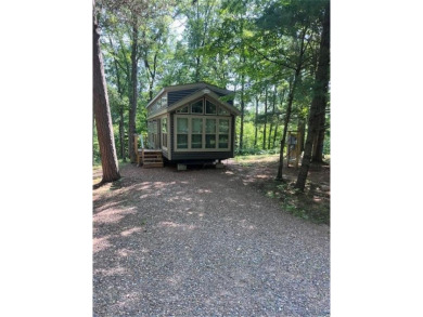 Have you been dreaming having your own permanent campsite?  Look on Voyager Village Country Club - Voyager in Wisconsin - for sale on GolfHomes.com, golf home, golf lot