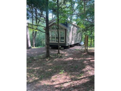 Have you been dreaming having your own permanent campsite?  Look on Voyager Village Country Club - Voyager in Wisconsin - for sale on GolfHomes.com, golf home, golf lot