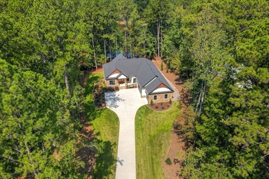 SOME PEOPLE DO EVERYTHING RIGHT! This LAKE FRONT home was CUSTOM on Monticello Golf Club At Savannah Lakes in South Carolina - for sale on GolfHomes.com, golf home, golf lot