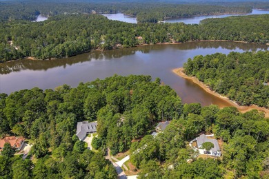 SOME PEOPLE DO EVERYTHING RIGHT! This LAKE FRONT home was CUSTOM on Monticello Golf Club At Savannah Lakes in South Carolina - for sale on GolfHomes.com, golf home, golf lot