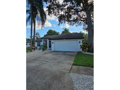 Step into this stunning split-floor plan residence and be on Tarpon Springs Golf Course in Florida - for sale on GolfHomes.com, golf home, golf lot