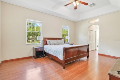 Welcome to your dream home! Nestled on a full acre of land in a on Wedgefield Golf Club in Florida - for sale on GolfHomes.com, golf home, golf lot