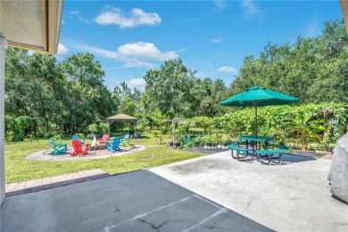 Welcome to your dream home! Nestled on a full acre of land in a on Wedgefield Golf Club in Florida - for sale on GolfHomes.com, golf home, golf lot