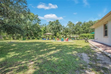 Welcome to your dream home! Nestled on a full acre of land in a on Wedgefield Golf Club in Florida - for sale on GolfHomes.com, golf home, golf lot