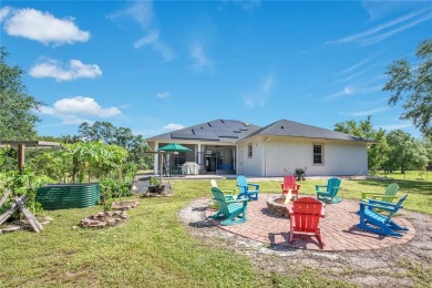 Welcome to your dream home! Nestled on a full acre of land in a on Wedgefield Golf Club in Florida - for sale on GolfHomes.com, golf home, golf lot