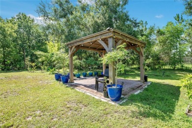 Welcome to your dream home! Nestled on a full acre of land in a on Wedgefield Golf Club in Florida - for sale on GolfHomes.com, golf home, golf lot