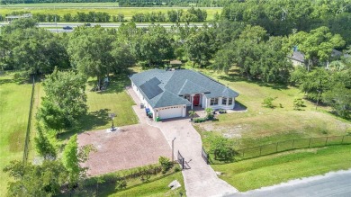 Welcome to your dream home! Nestled on a full acre of land in a on Wedgefield Golf Club in Florida - for sale on GolfHomes.com, golf home, golf lot