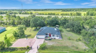 Welcome to your dream home! Nestled on a full acre of land in a on Wedgefield Golf Club in Florida - for sale on GolfHomes.com, golf home, golf lot