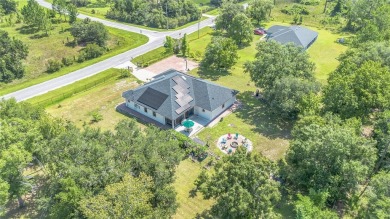 Welcome to your dream home! Nestled on a full acre of land in a on Wedgefield Golf Club in Florida - for sale on GolfHomes.com, golf home, golf lot