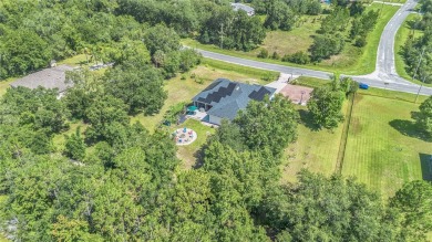 Welcome to your dream home! Nestled on a full acre of land in a on Wedgefield Golf Club in Florida - for sale on GolfHomes.com, golf home, golf lot