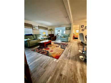 The key word with this home is NEW! New upgraded luxury vinyl on Fairway Village Golf Course in Florida - for sale on GolfHomes.com, golf home, golf lot