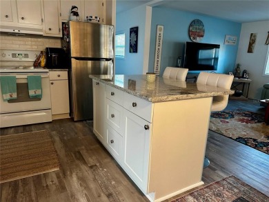 The key word with this home is NEW! New upgraded luxury vinyl on Fairway Village Golf Course in Florida - for sale on GolfHomes.com, golf home, golf lot