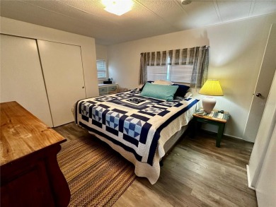The key word with this home is NEW! New upgraded luxury vinyl on Fairway Village Golf Course in Florida - for sale on GolfHomes.com, golf home, golf lot
