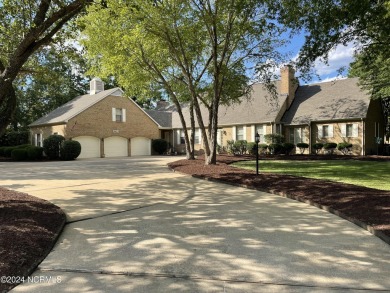 This waterfront resort home offers a lifestyle immersed in on Harbour Point Golf Club in North Carolina - for sale on GolfHomes.com, golf home, golf lot