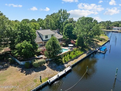 This waterfront resort home offers a lifestyle immersed in on Harbour Point Golf Club in North Carolina - for sale on GolfHomes.com, golf home, golf lot